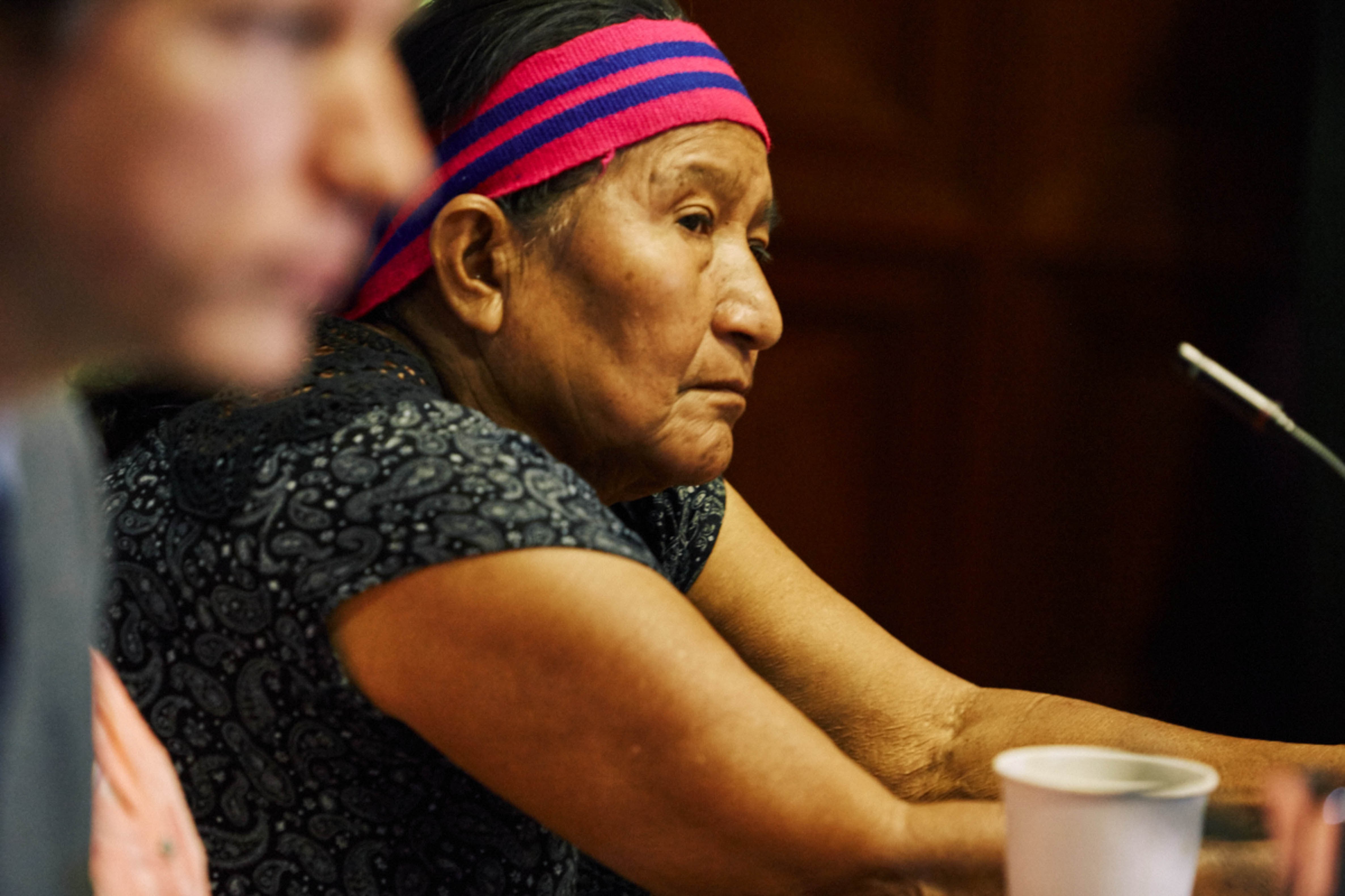 Adolfina García speaks at a press conference in Peru, announcing the settlement between the Achuar communities and Occidental Petroleum.