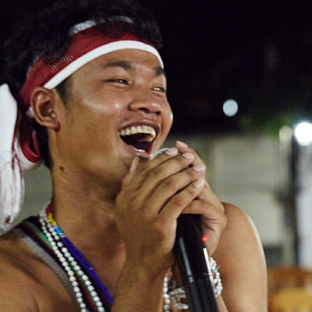 Vireak, an indigenous youth activist from Cambodia, leads the crowd in traditional song and dance at the welcoming of the tenth EarthRights School Mekong class.