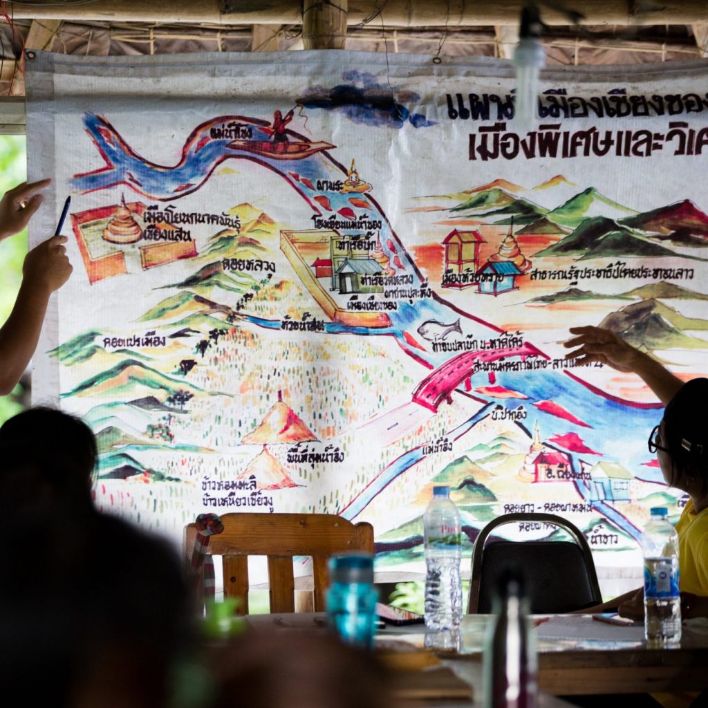 This map titled “Chiang Khong - Special and Amazing City” - was made by members of Rak Chiang Khong. Jeerasak Inthayod, a Rak Chiang Khong team member, explains their work and tactics, including campaigning and legal strategies, to stop both the Pak Beng dam on the Mekong River and projects to blast apart rapids on the Mekong to make room for Chinese riverboat transportation. The Pake Beng dam would displace 6,700 people and is one of 11 dams planned for the lower Mekong – a cascade of development that threatens the food security of 48 million people.