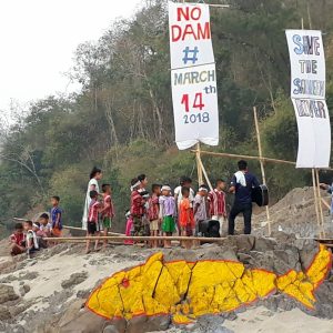 Local communities gather near the site of the proposed Hatgyi dam on the Salween River to protest the project.