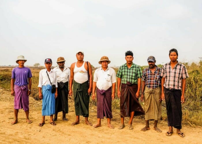 A group of the 33 farmers on their land near Thilawa Special Econoimc Zone in Myanmar.