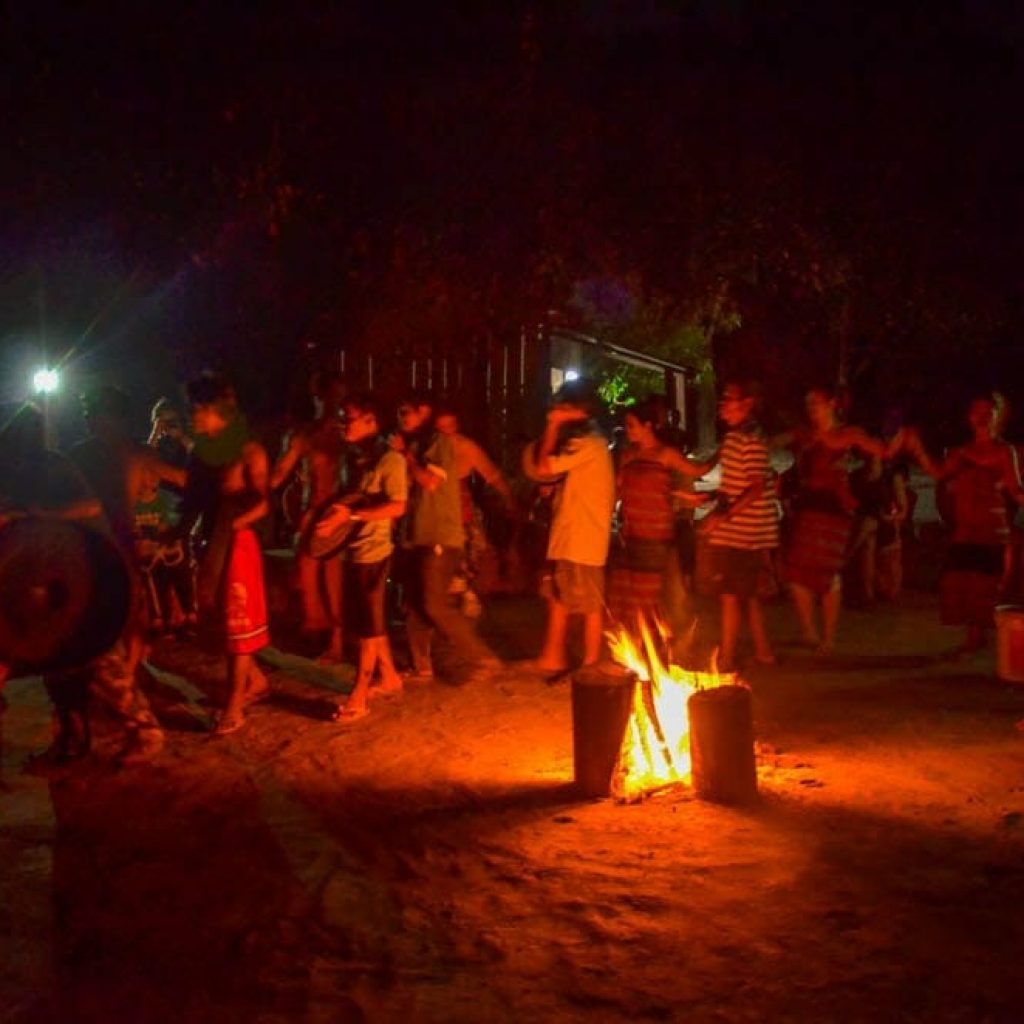 The villagers perform a folk dance show.