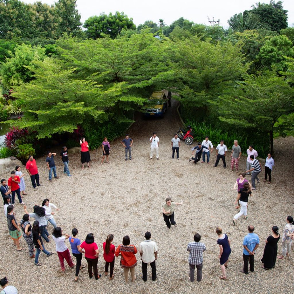 Participants play a game to get to know one another. The Forest Defenders Conference provided chances for earth rights defenders to build relationships and strengthen networks of solidarity.
