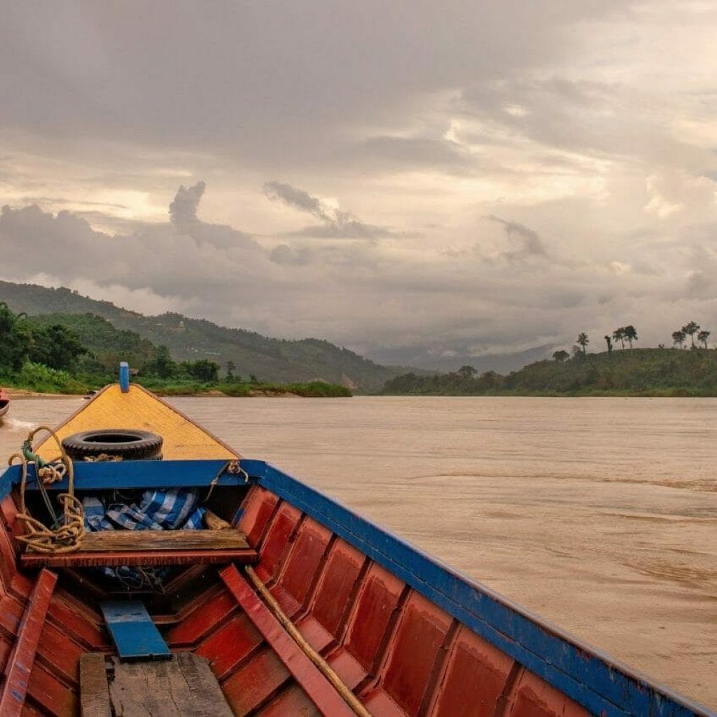 Boats carry people and goods up and down the Mekong River near Chaing Khong, Thailand.