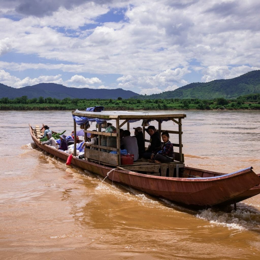 A boat crosses the Mekong River in northern Thailand near Chiang Khong.