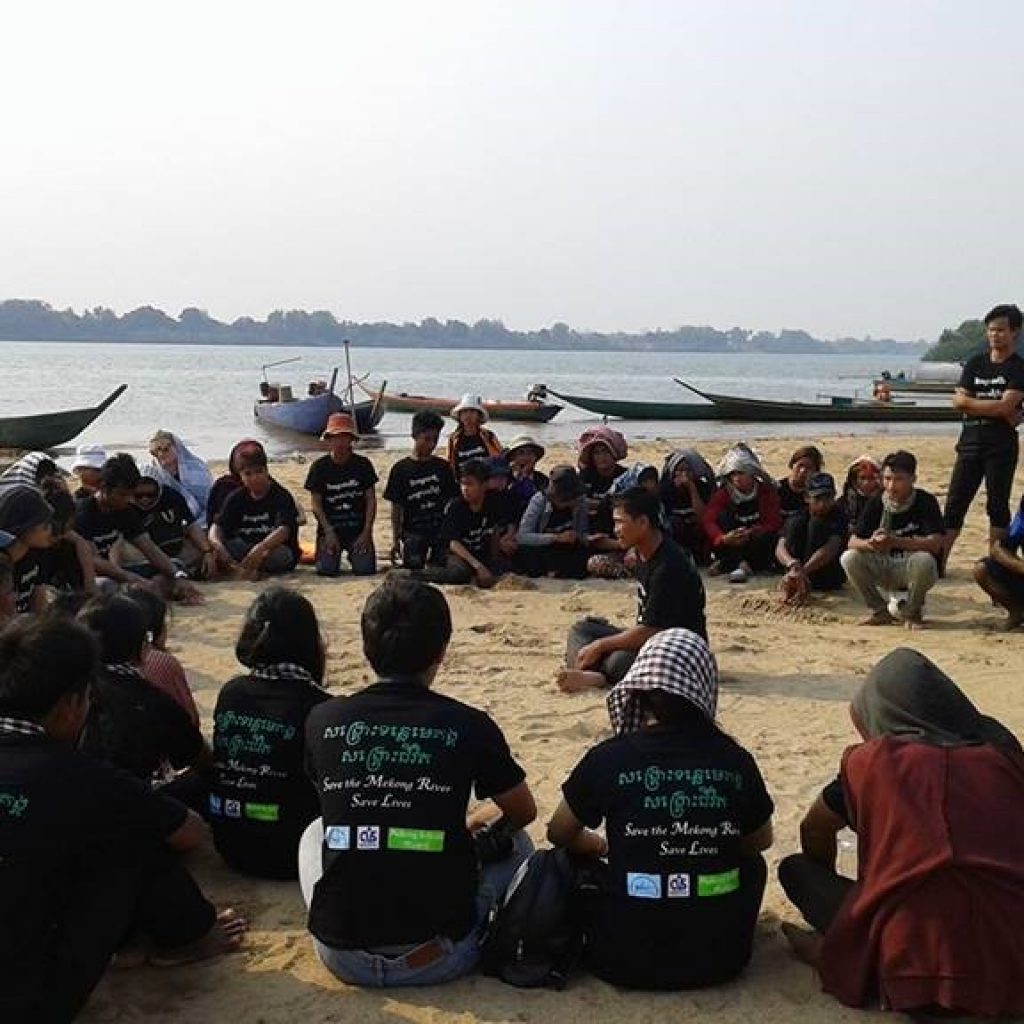 ERI staff, university students, youth groups and representatives from other NGOs gather on the bank of the Mekong River in Sambor for International Day of Action for Rivers.