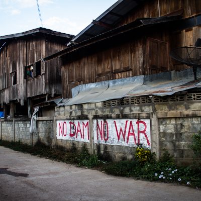 Graffiti in Sa-iab Village. Every house has signs that say things like “We will fight and die here.” Kaeng Sua Ten is well known for protesting by making effigies of politicians who support the construction of the dam. It is believed that through a spirit medium they can curse the politicians until they fall ill and die.